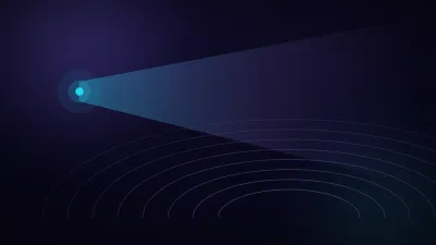 A wide beam of violet light spreading from a single point across a dark stage toward rows of faint concentric arcs
